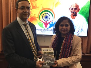Archana Painuly presenting her book Highway E47 to the Ambassador